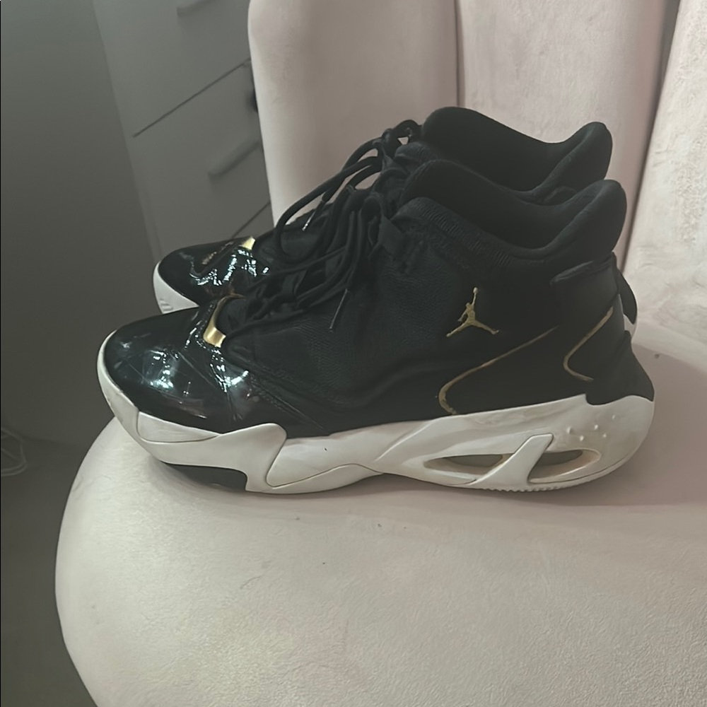 Jordan Black and Gold Athletic Shoes with Modern Design